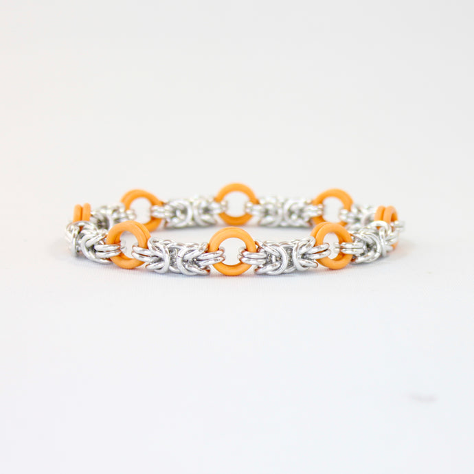 The Byz Stretch Bracelet in Orange + Silver