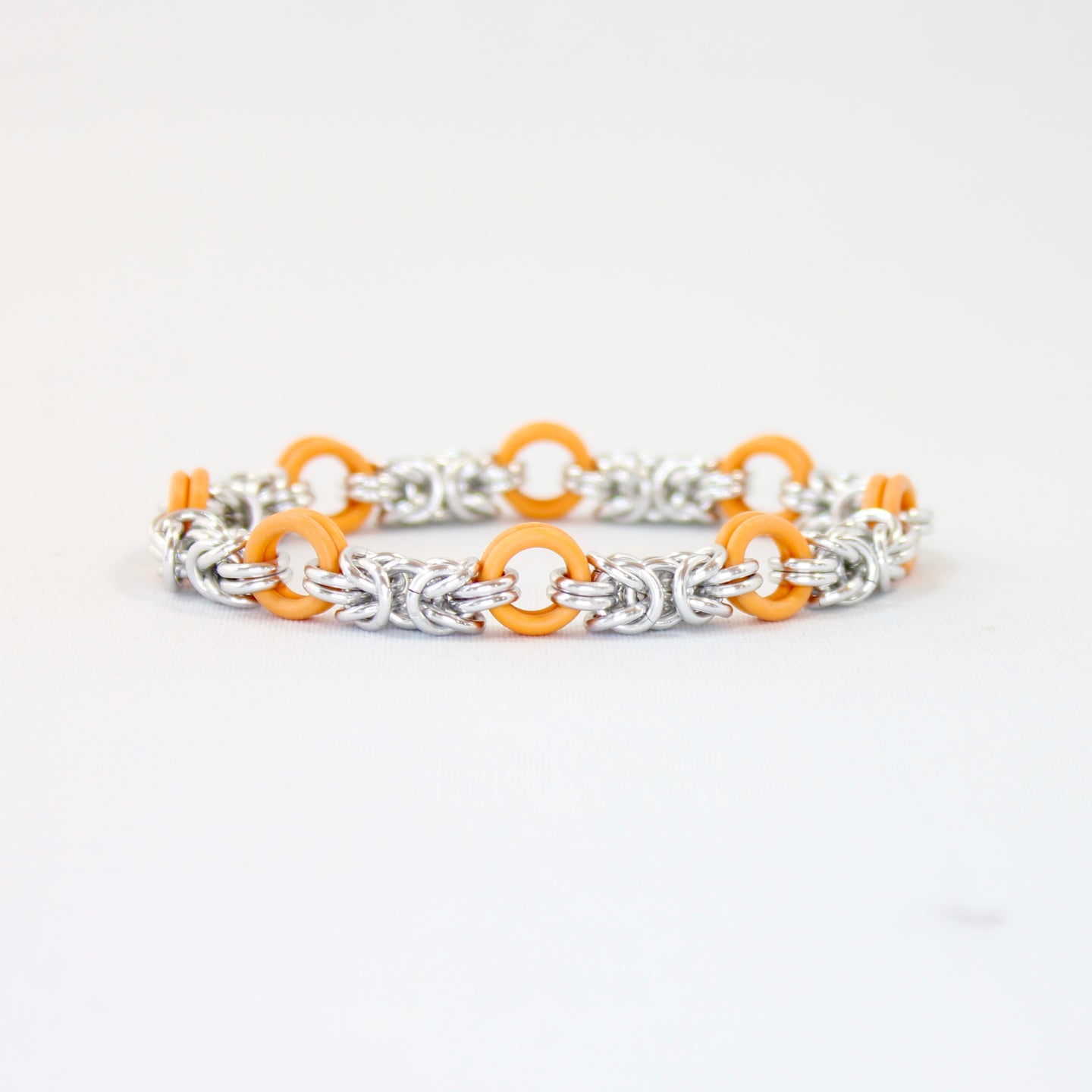 The Byz Stretch Bracelet in Orange + Silver